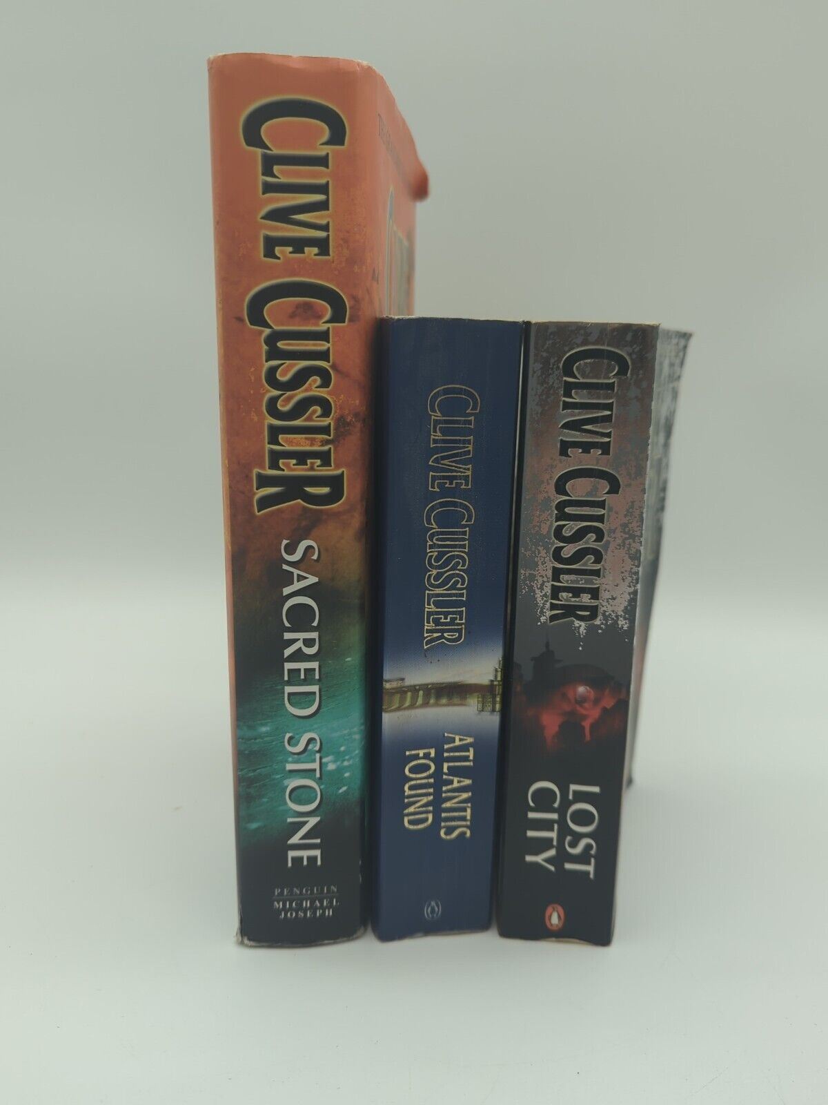 3x Clive Cussler book bundle Sacred Stone (Hardcover), Lost City, Atlantis Found