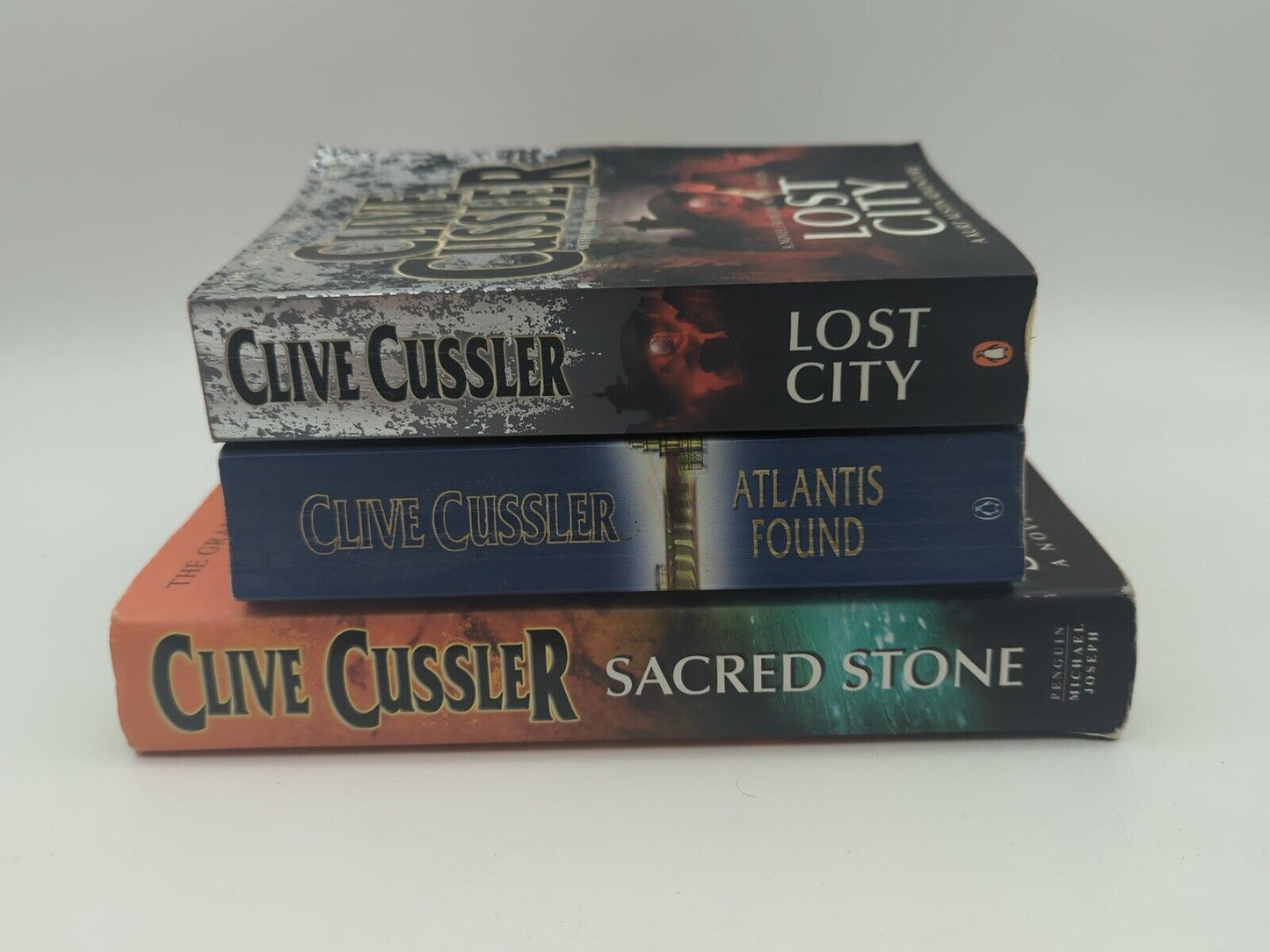 3x Clive Cussler book bundle Sacred Stone (Hardcover), Lost City, Atlantis Found